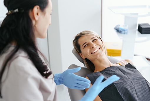 Dental patient smiling at her dentist