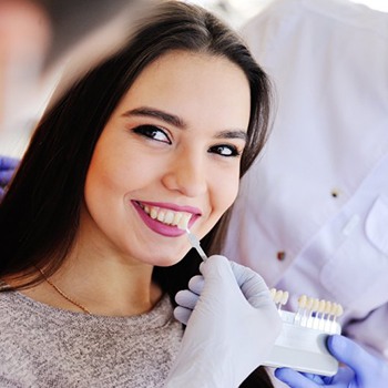 a person smiling with healthy and bright teeth